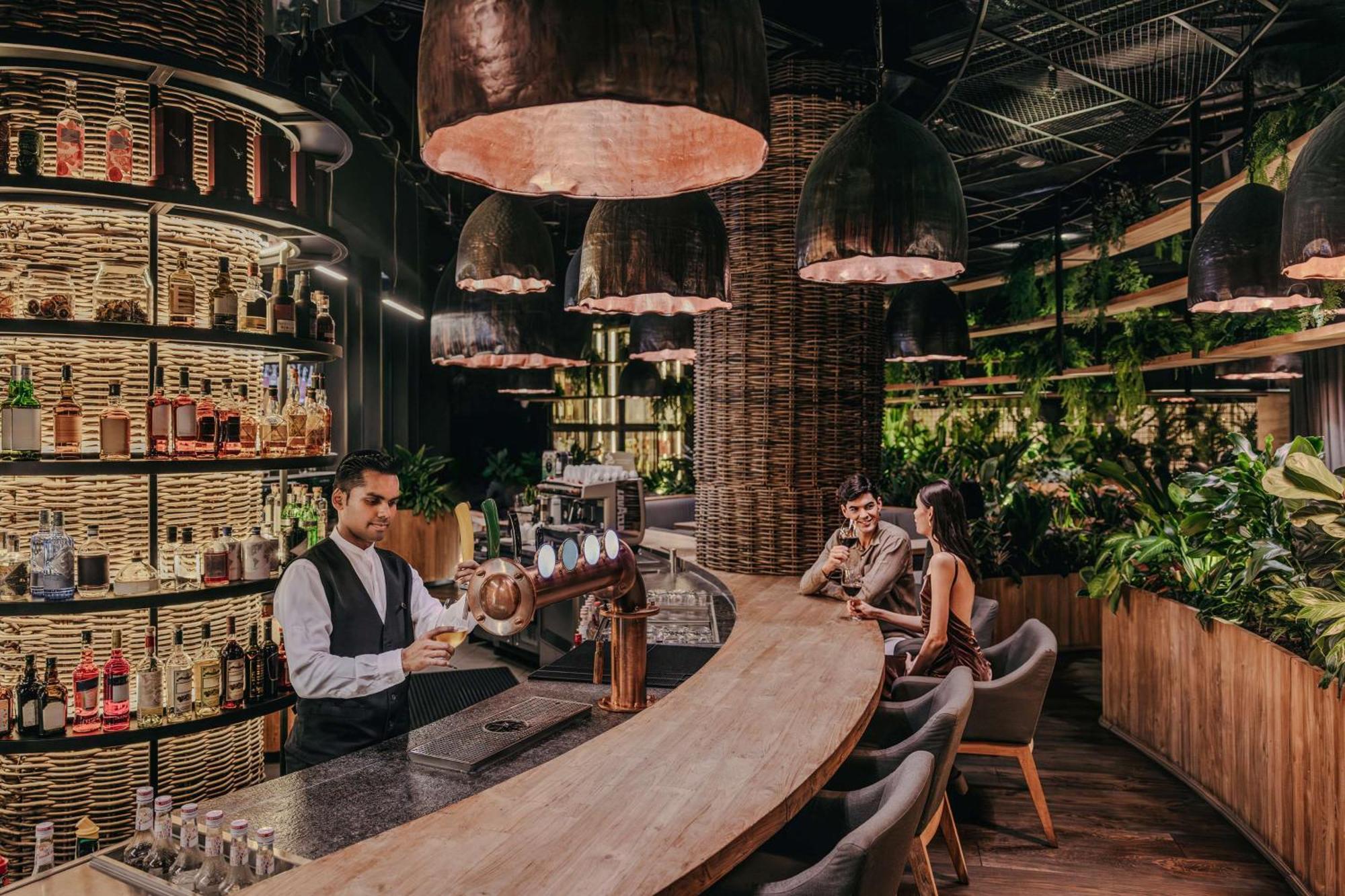 Dusit Thani Laguna Singapore Bagian luar foto The interior of a typical Starbucks Reserve store